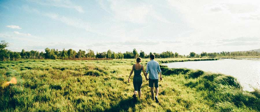 couple walking in field