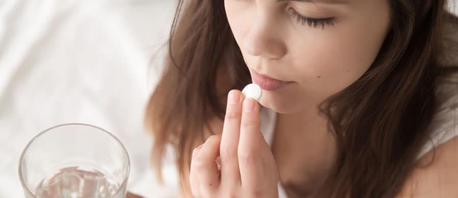 Are You Addicted to Your Anxiety Medication? woman taking anxiety medication