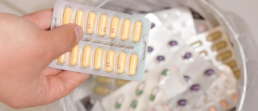 Can I Quit Drugs Cold Turkey On My Own? person throwing pills away
