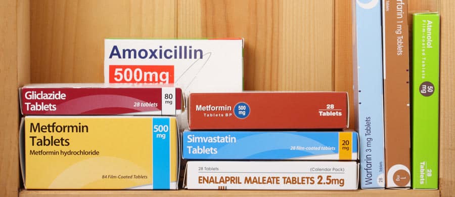 prescription drug boxes on shelf