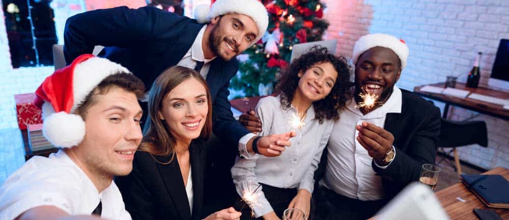 Holiday Spirits: It’s the Booziest Time of the Year friends having a party