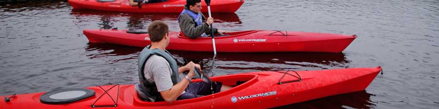 friends kayaking together