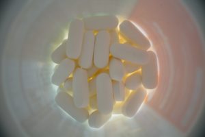 Looking down into a bottle of pills