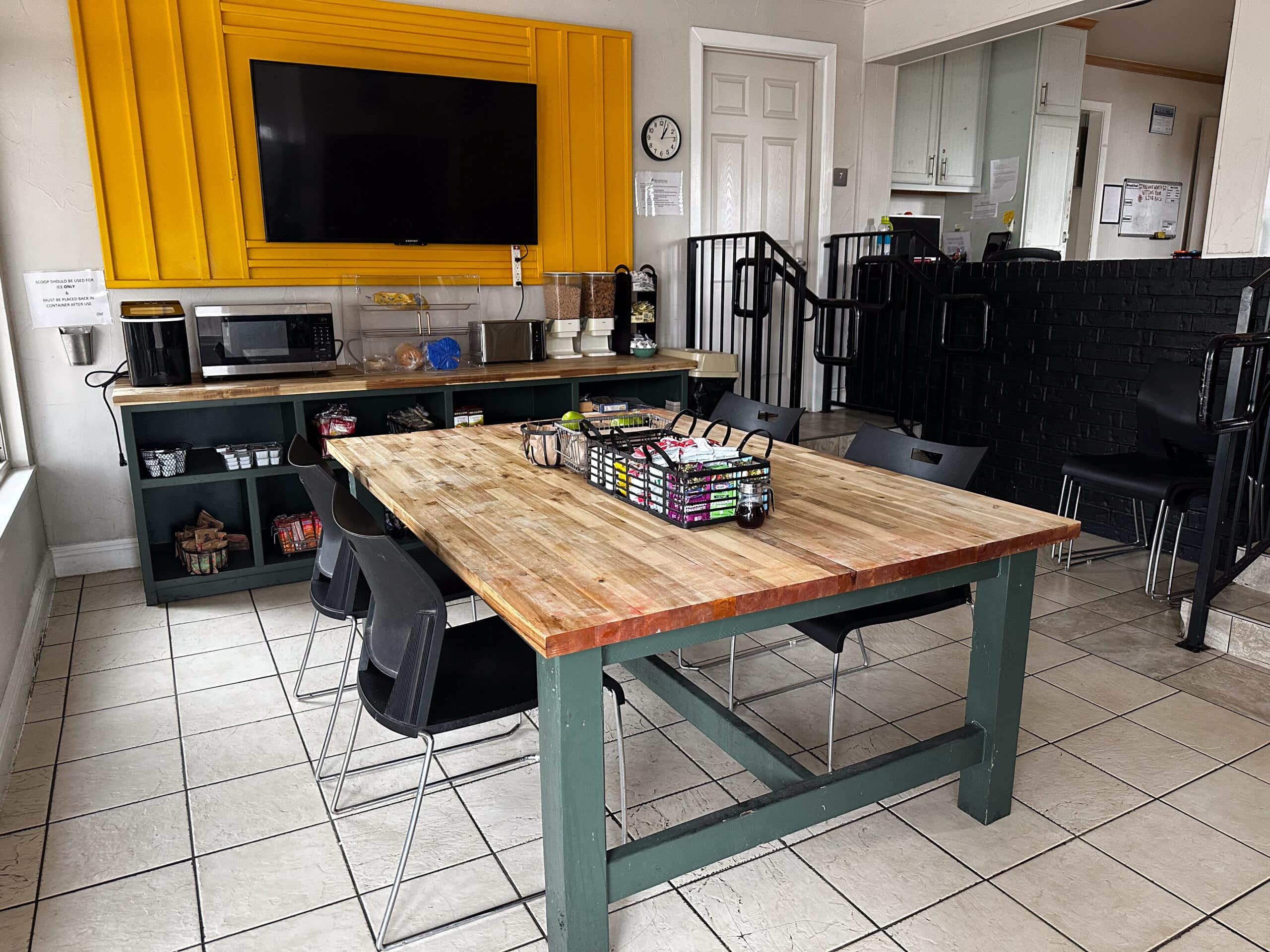 Communal kitchen and dining setup at Briarwood Detox Center Austin with coffee station and microwave.