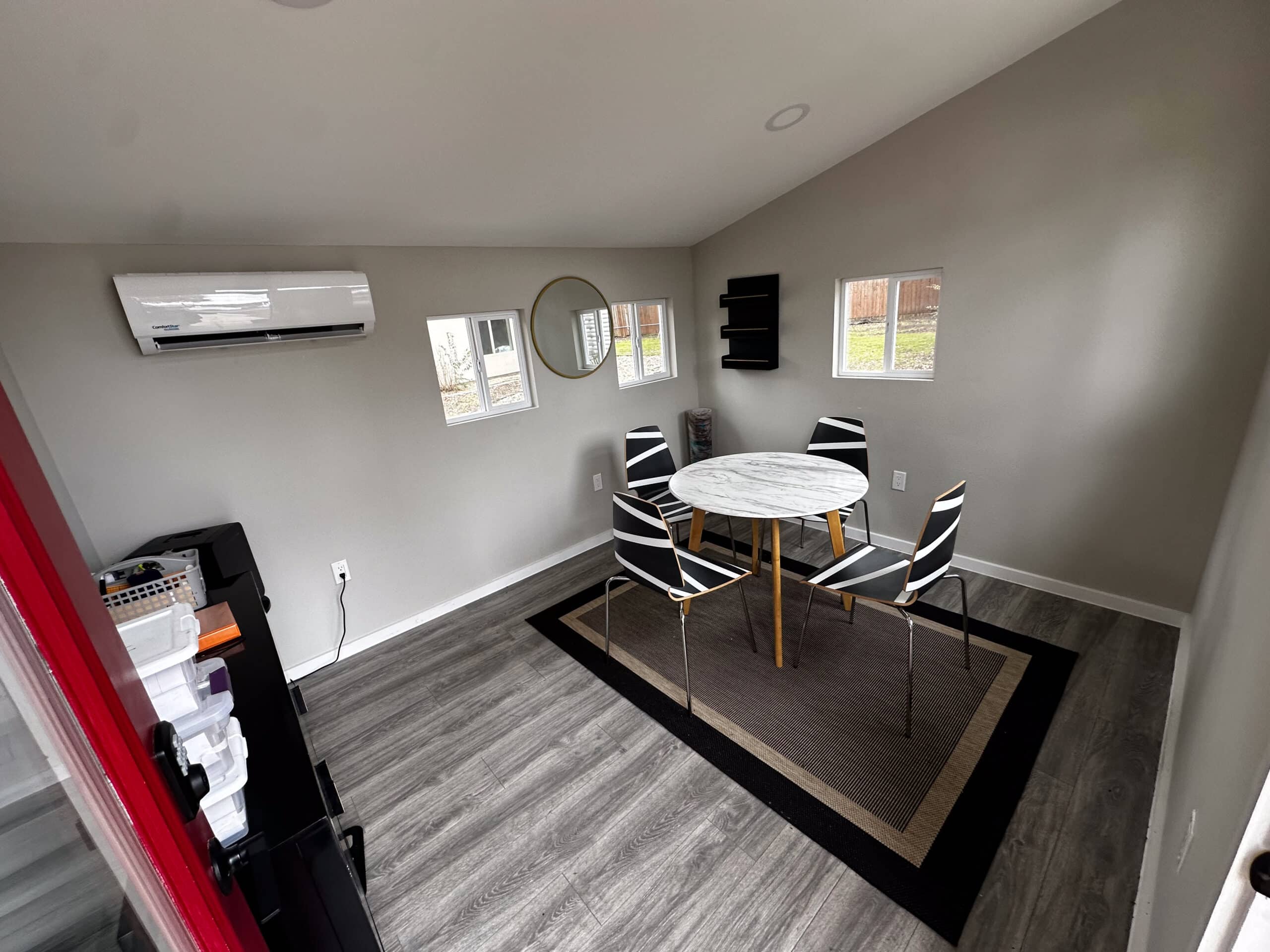 Small group meeting room at Briarwood Detox Center Austin with round marble table and four chairs.