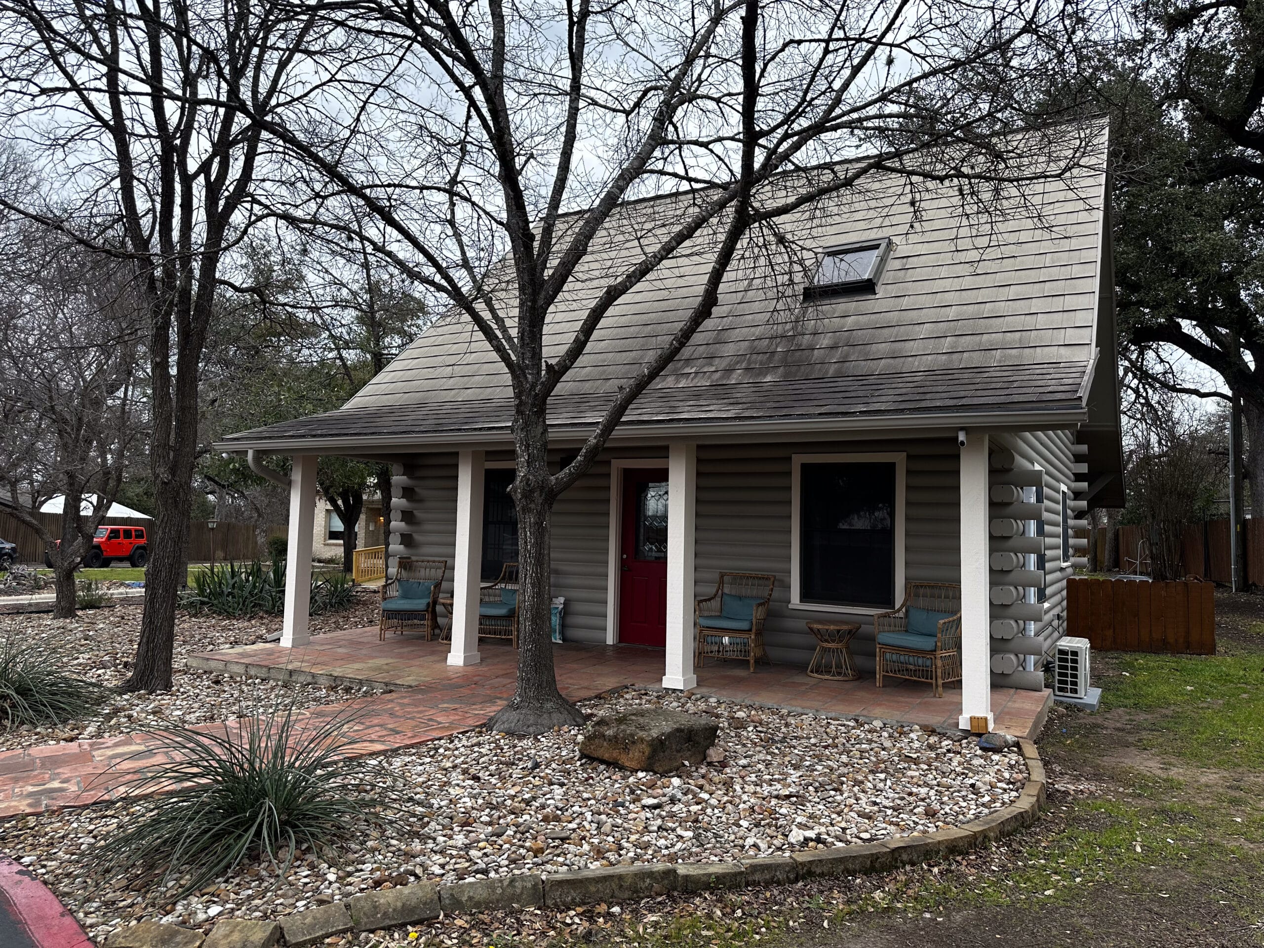 Close-up view of Briarwood Detox Center Austin front exterior with porch seating.