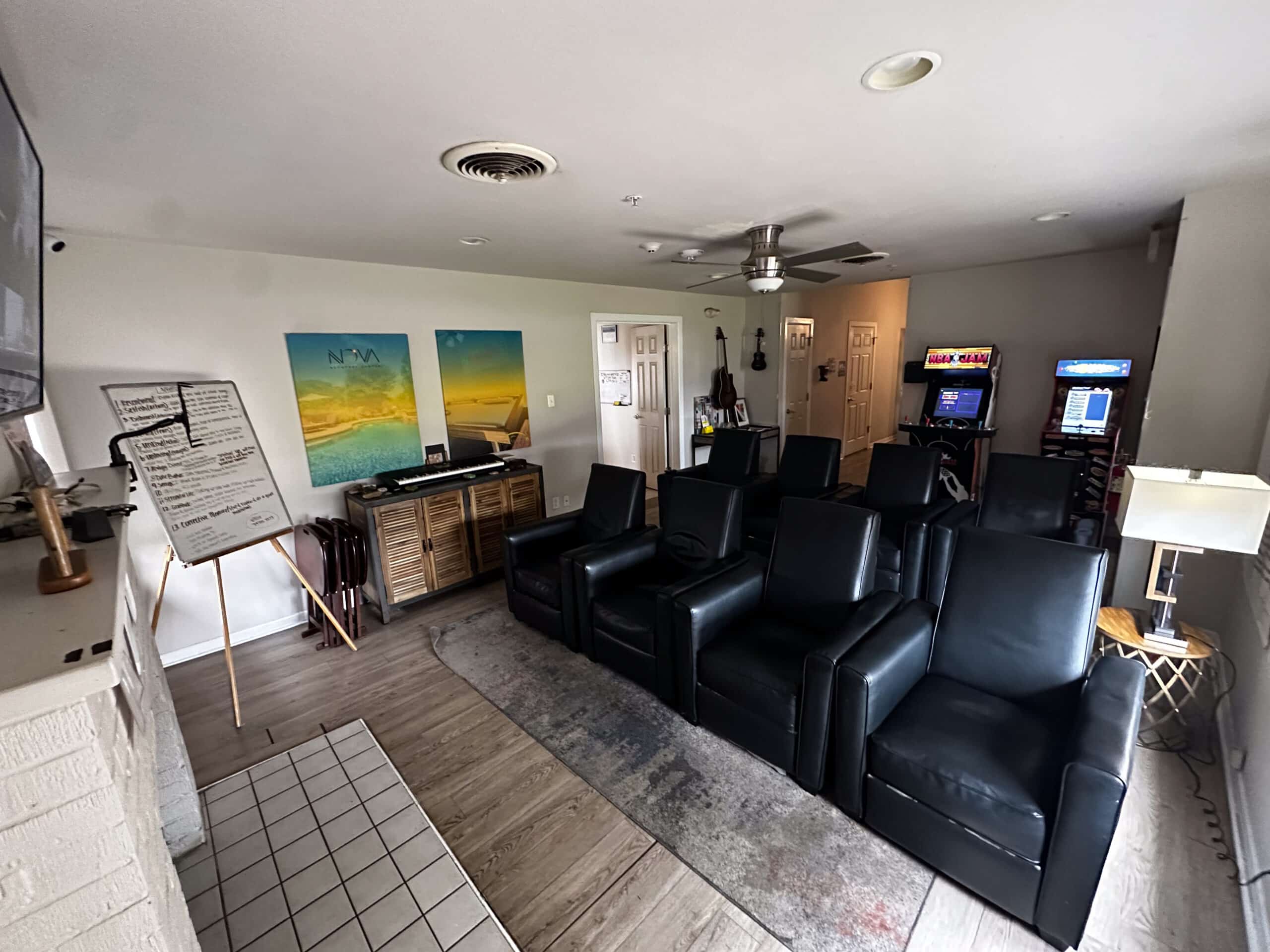 Group lounge with recliners and educational whiteboard at Briarwood Detox Center Austin.