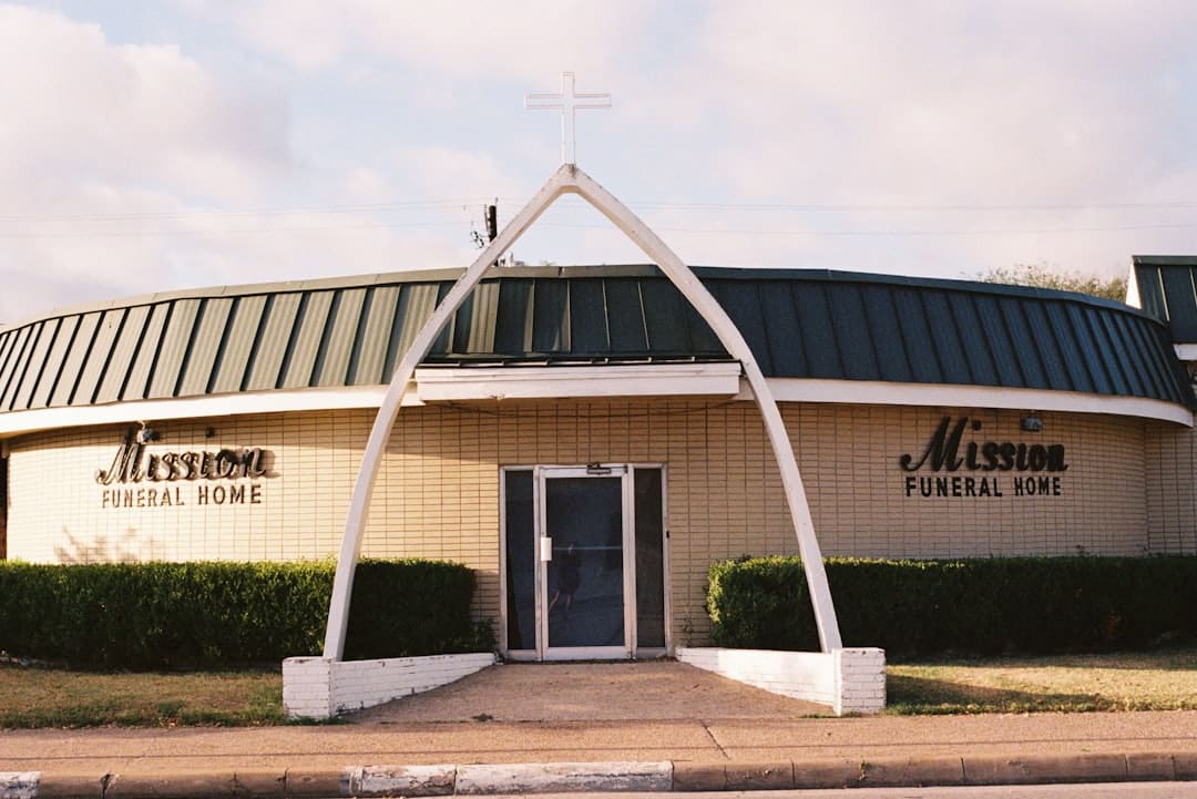 Mission funeral home building with arched entrance -- Photo by Sasha Matveeva on Unsplash