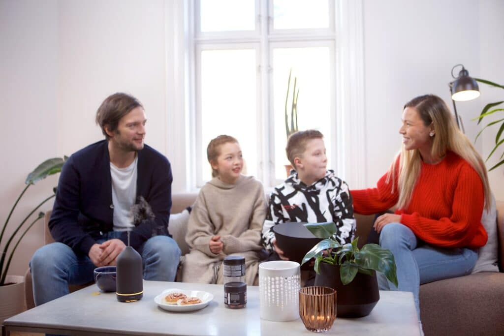 a group of people sitting around a table -- Photo by volant on Unsplash
