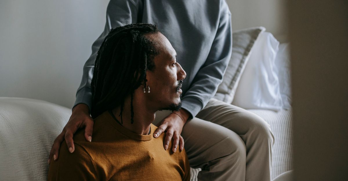 Young black couple spend time in casual outfit with sad face in room in daytime